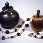 Porcelain jars with lamp work glass bead necklace
