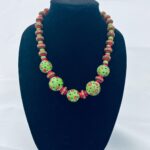 "Afro Pop" necklace, 22"L, lamp work glass beads, dyed coral, vinyl beads and sterling clasp with bakelite