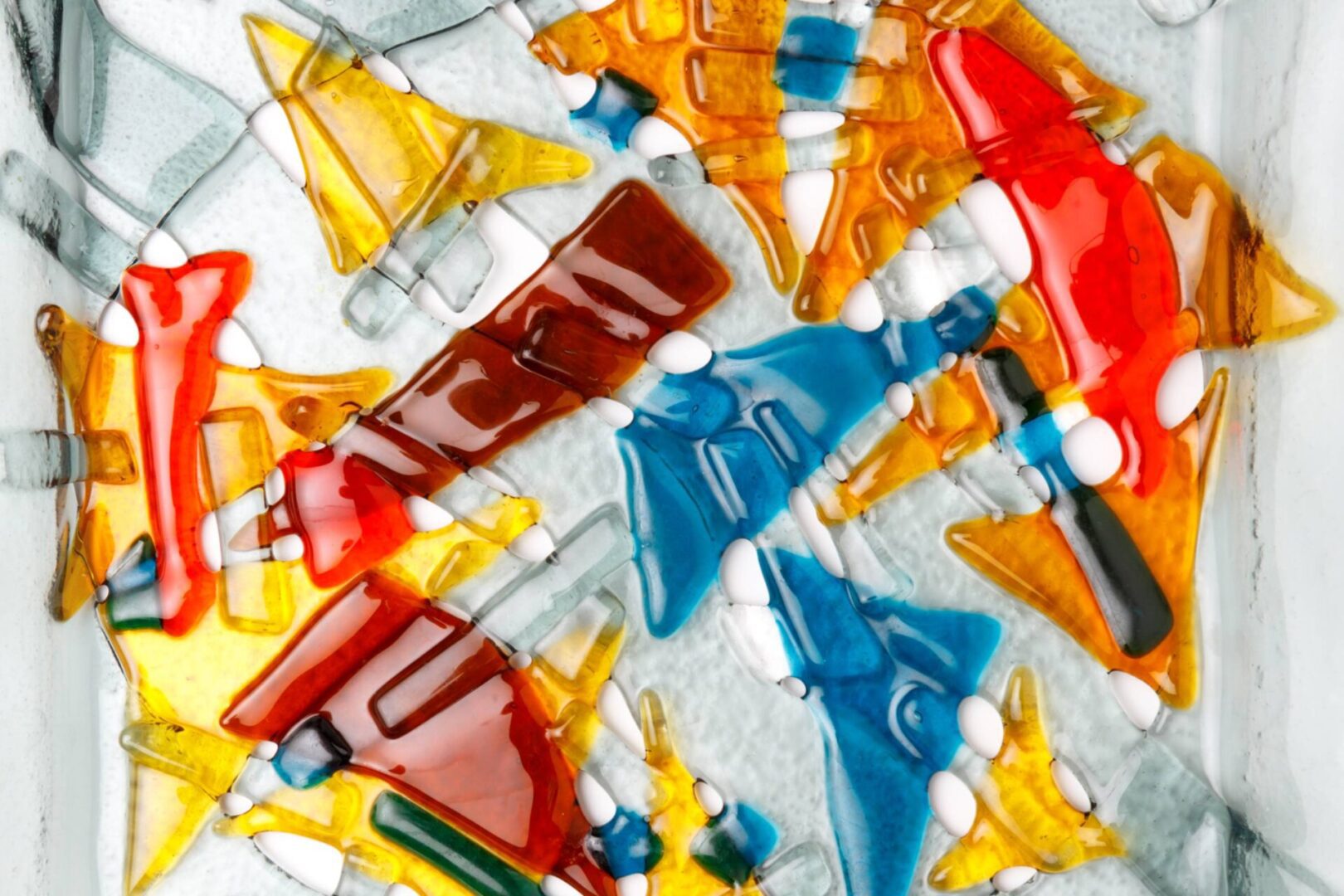 Vibrant stained glass fish shapes