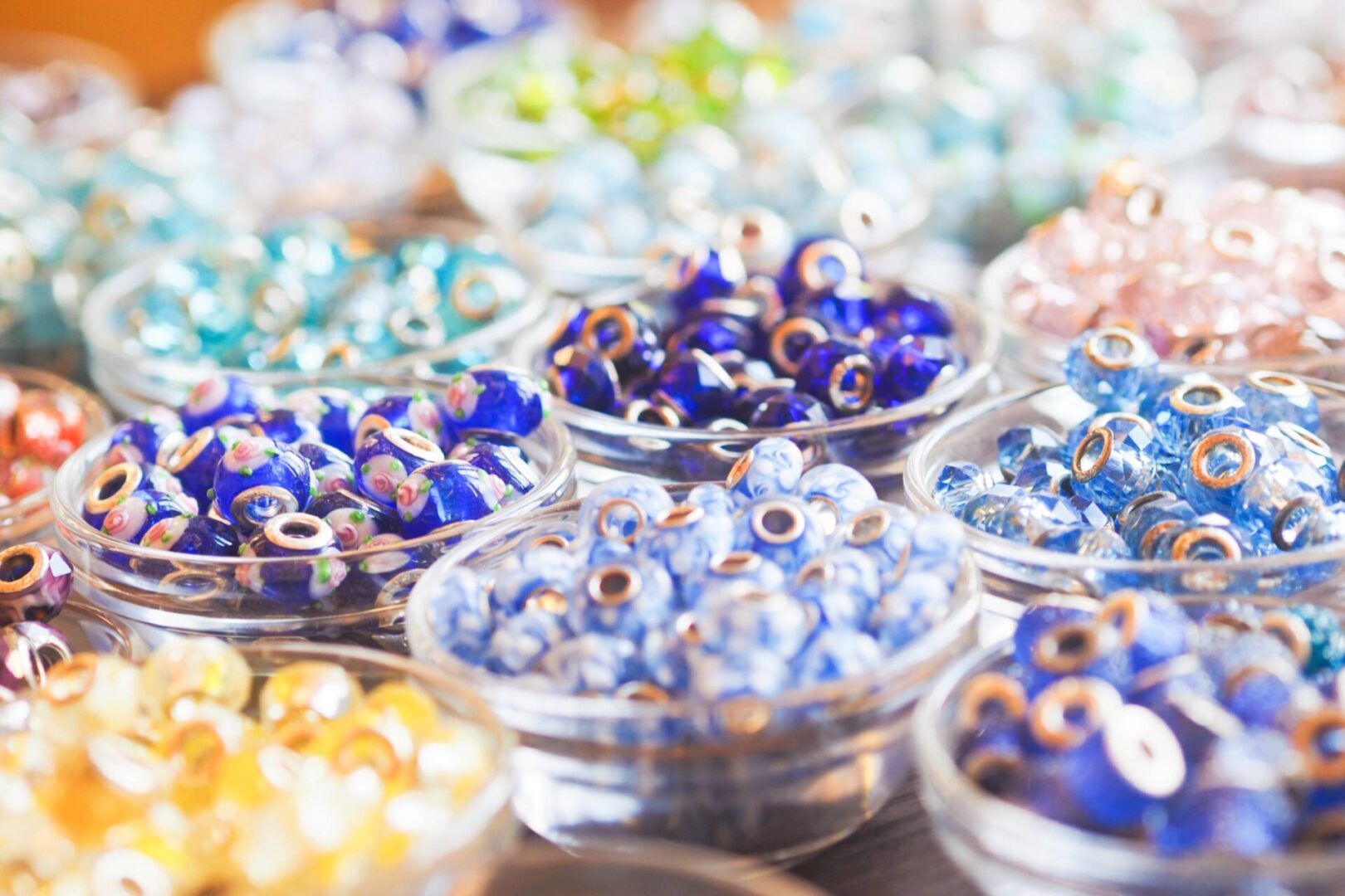 Assorted beads displayed in dishes