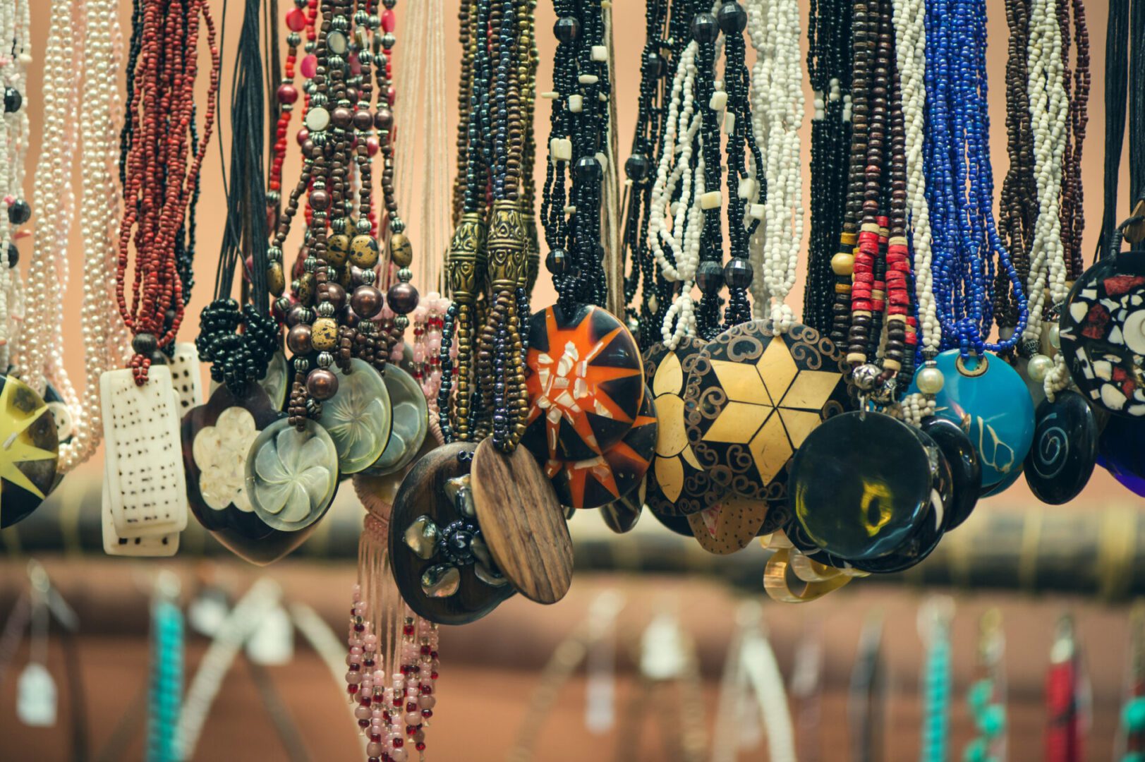 Assorted beaded necklaces with unique pendants